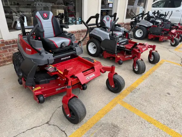 Exmark and Spartan riding mowers on the lot